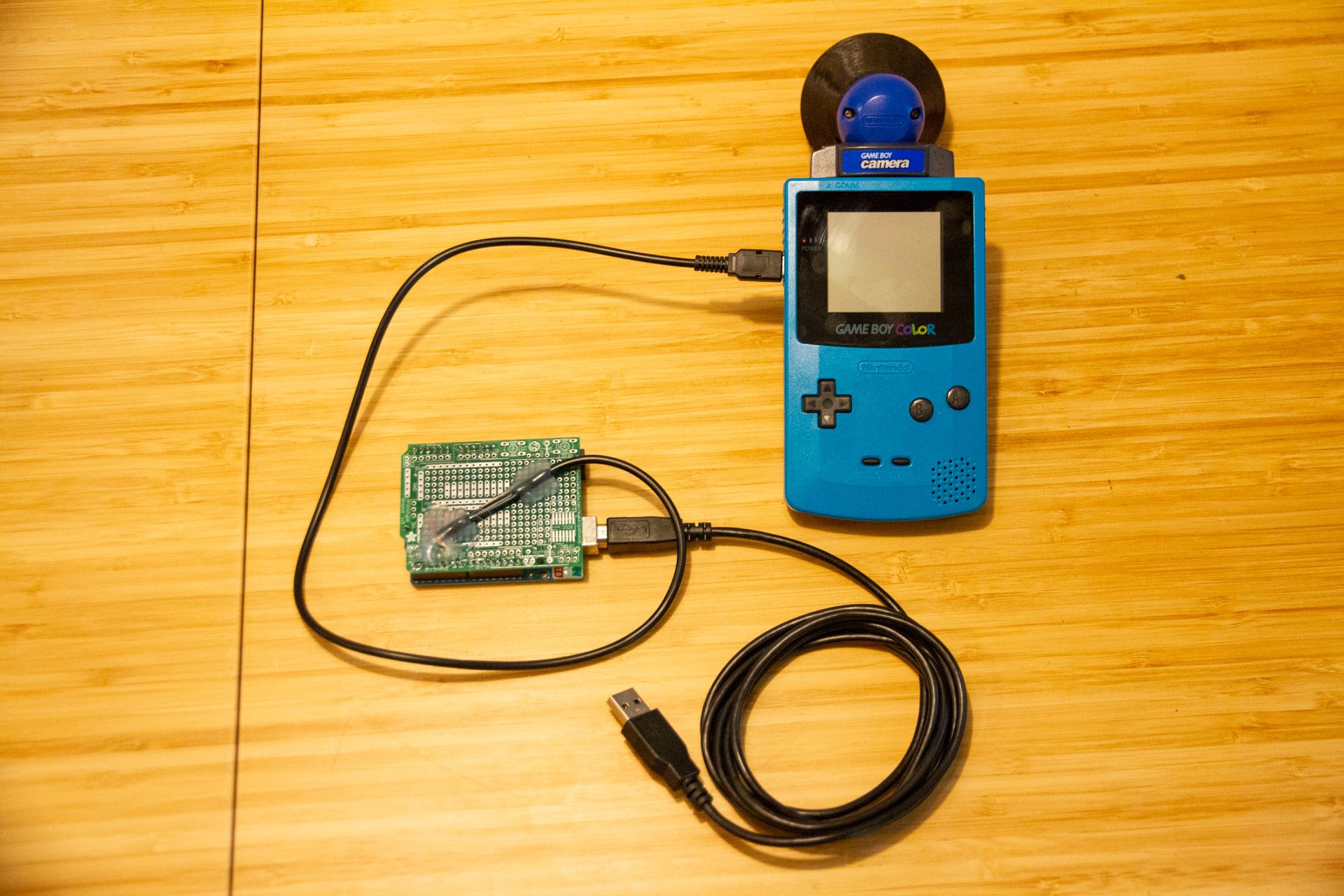The Game Boy connected to an Arduino through a cut link cable